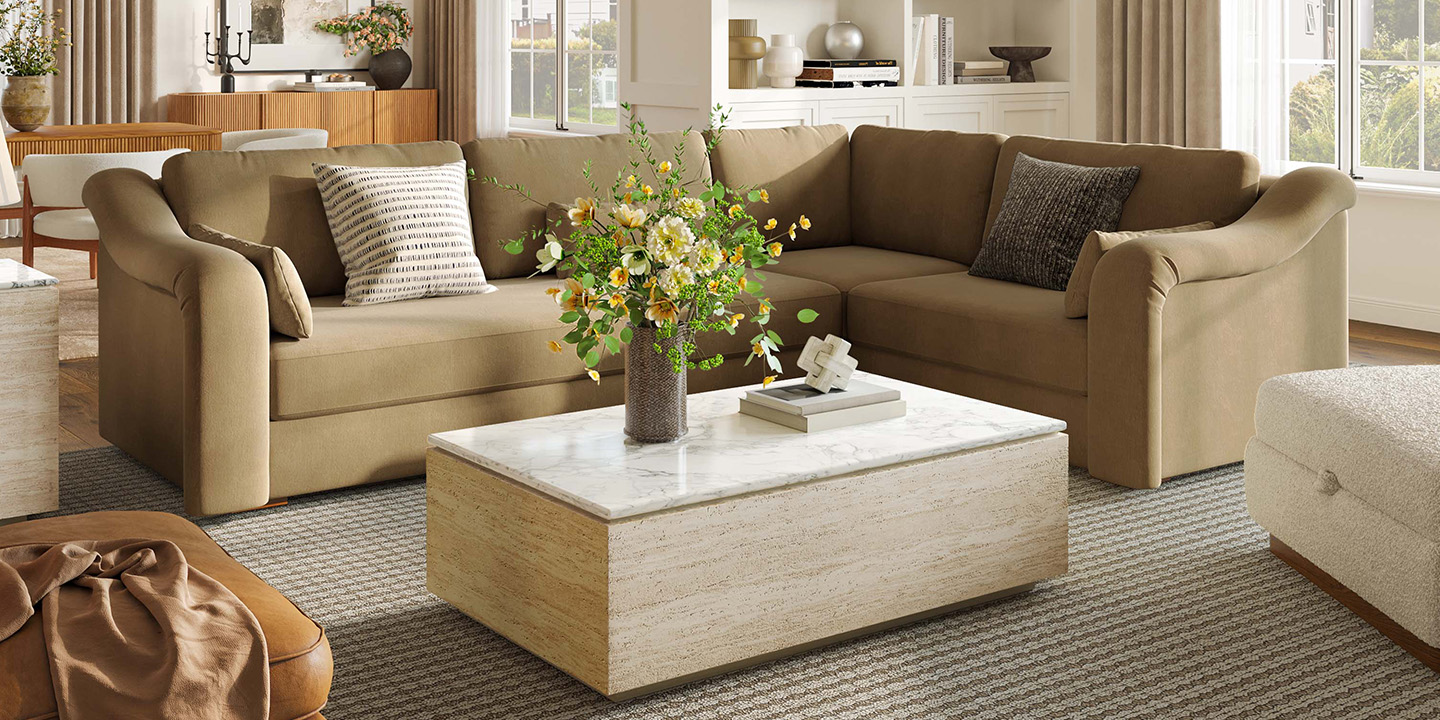 Renata 47.2-inch travertine-textured coffee table with a 15-inch coffee table height, paired with a cozy sectional sofa in a modern living room.