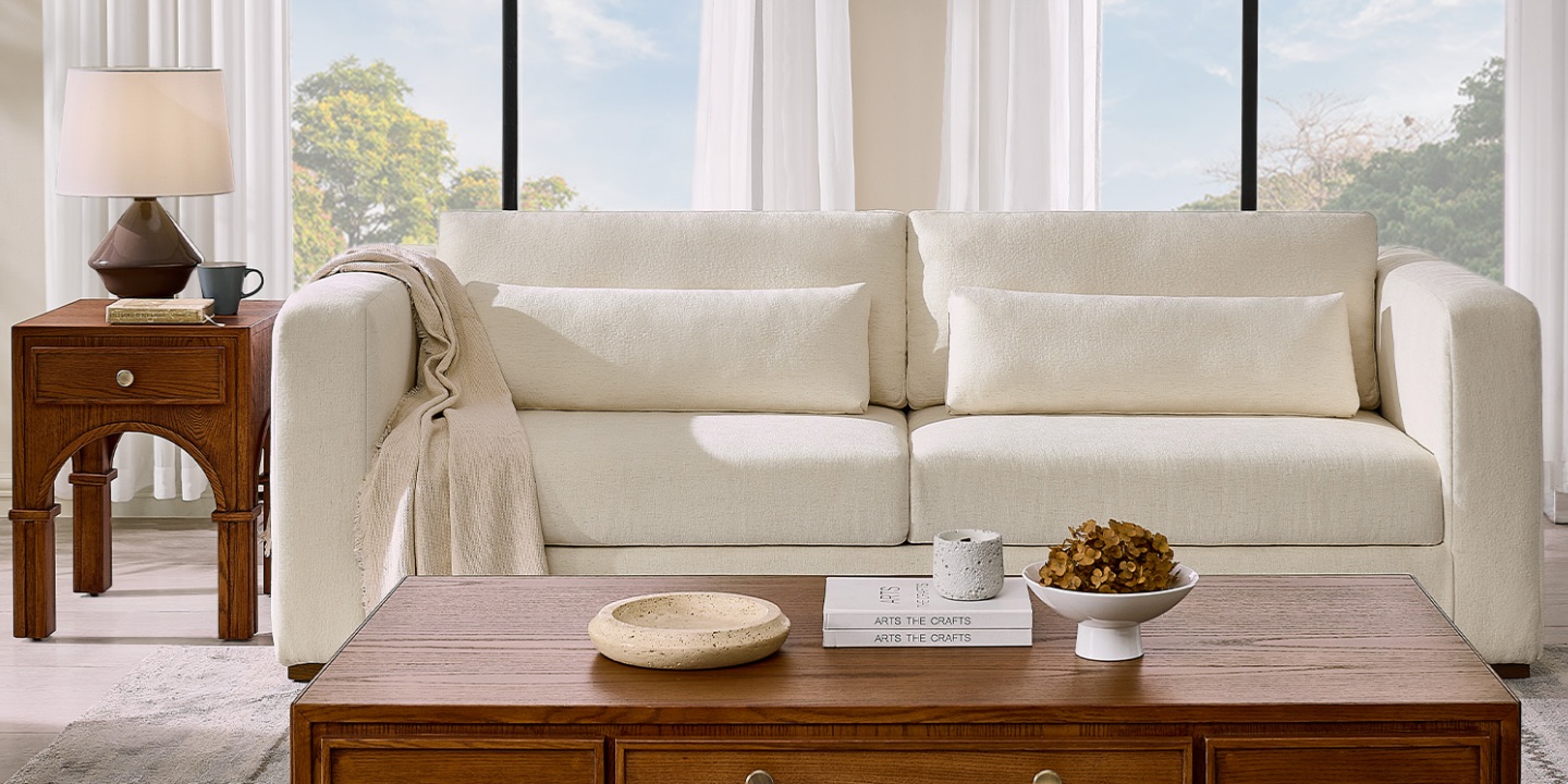 Alba 91" Sofa featuring wide armrests and supportive lumbar pillows on a neutral fabric couch