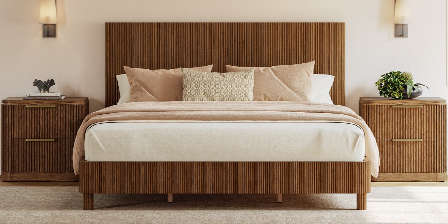 King bed size Fulton Fluted Oak Bed with dynamic fluting on the solid wood frame and matching metal-handled nightstands in a luxurious bedroom.