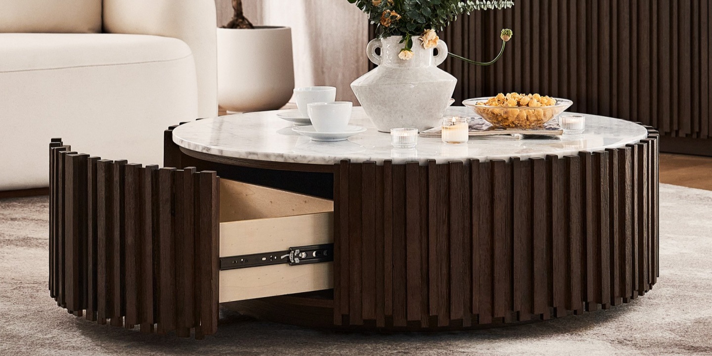 Armonia 41.3" carrara marble round coffee table featuring a natural Italian Carrara marble top and a sculptural base with interlacing rubber wood slats.