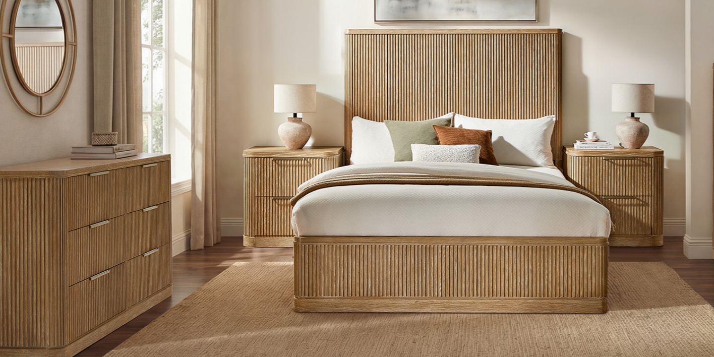 A feng shui bedroom layout featuring the 5-Piece Finnley Fluted Bedroom Set, symmetrical nightstands, and a large dresser.