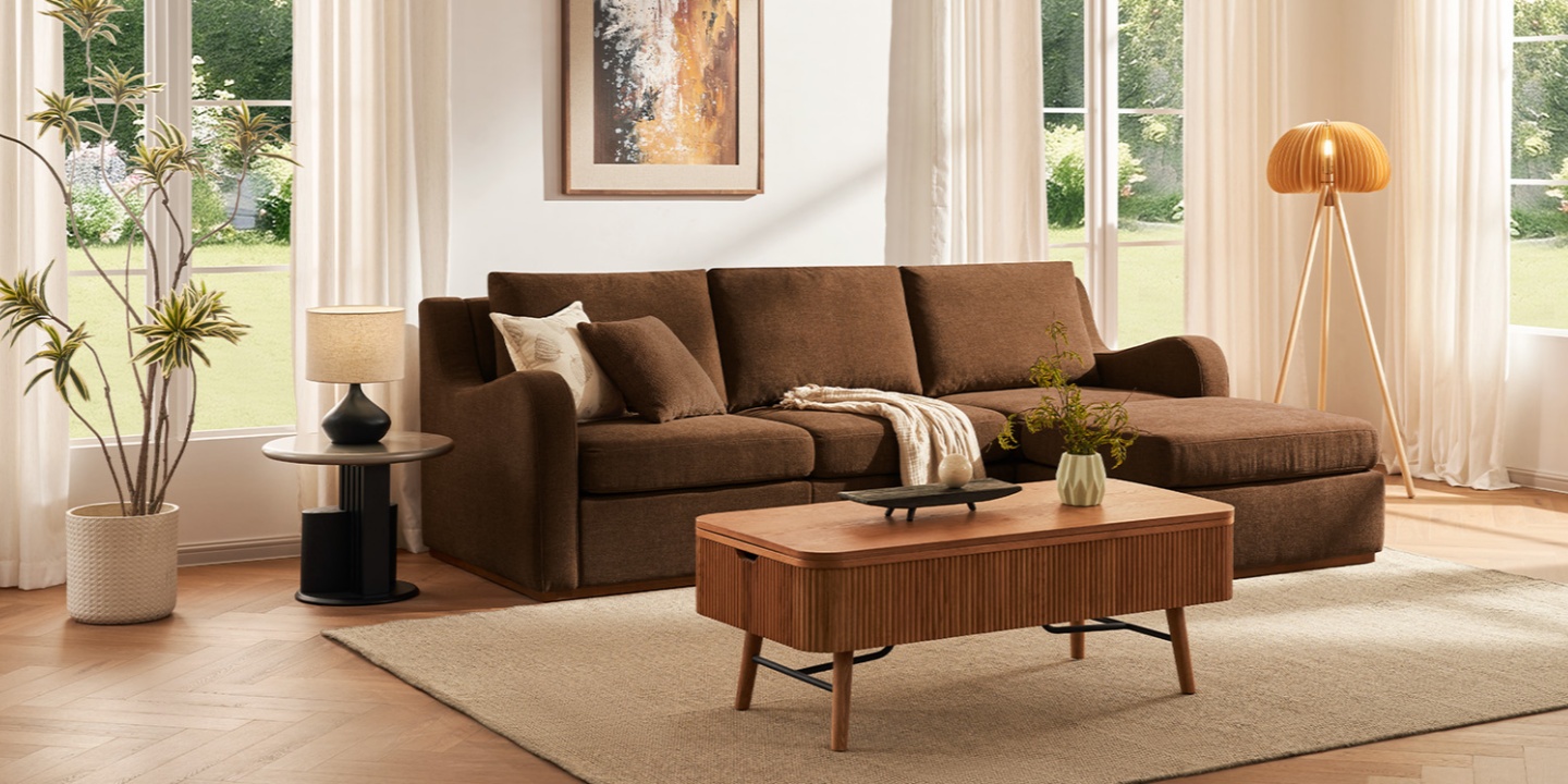 A relaxing sunlit feng shui living room with a modular sectional sofa, large windows, wood lift-top coffee table, and houseplants.