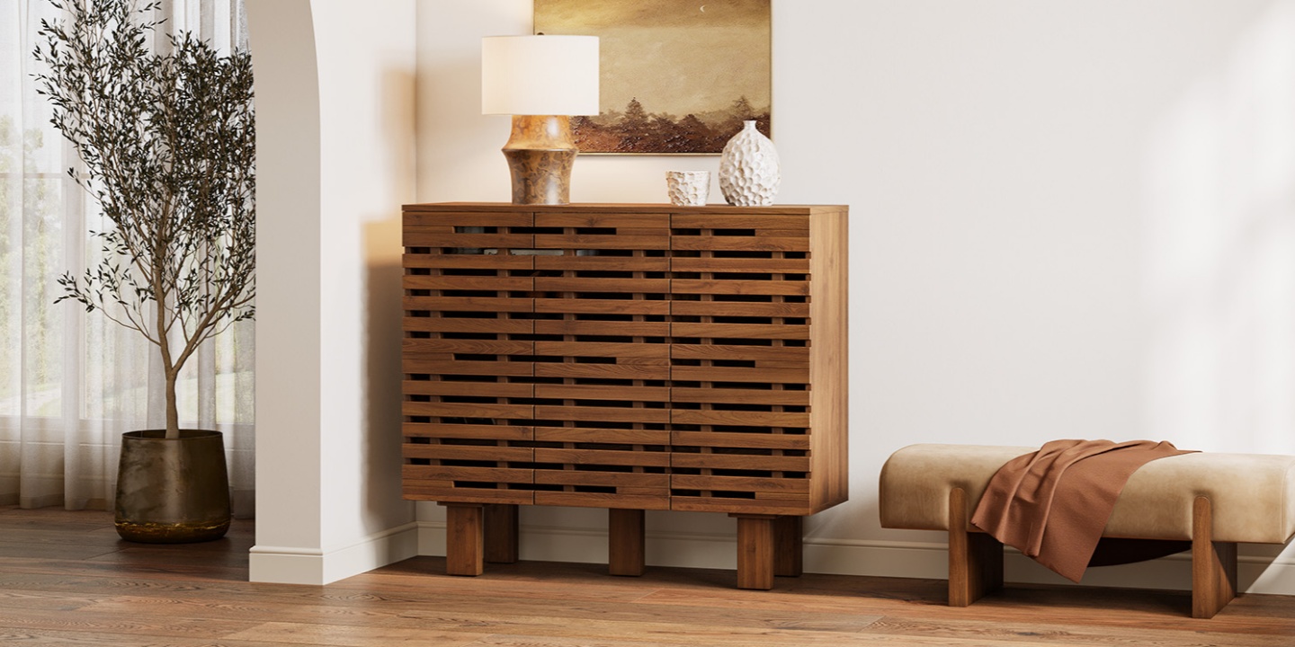 Ingrid 47-inch oak shoe storage cabinet with fence-like slatted doors styled in a modern home entryway. Ingrid 47-inch oak shoe storage cabinet with fence-like slatted doors styled in a modern home entryway.