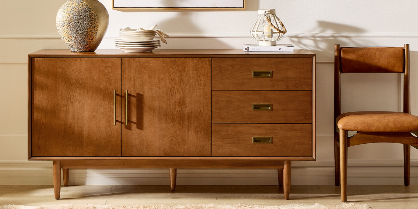 This brown sideboard demonstrates how to choose a sideboard that blends mid-century style with practical storage. This brown sideboard demonstrates how to choose a sideboard that blends mid-century style with practical storage.