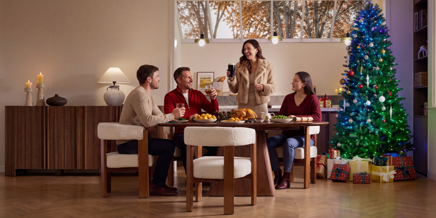 The Christmas tree is strategically placed in the corner, anchoring the festive dining area between the sideboard and the window, complete with gifts at its base. The Christmas tree is strategically placed in the corner, anchoring the festive dining area between the sideboard and the window, complete with gifts at its base.