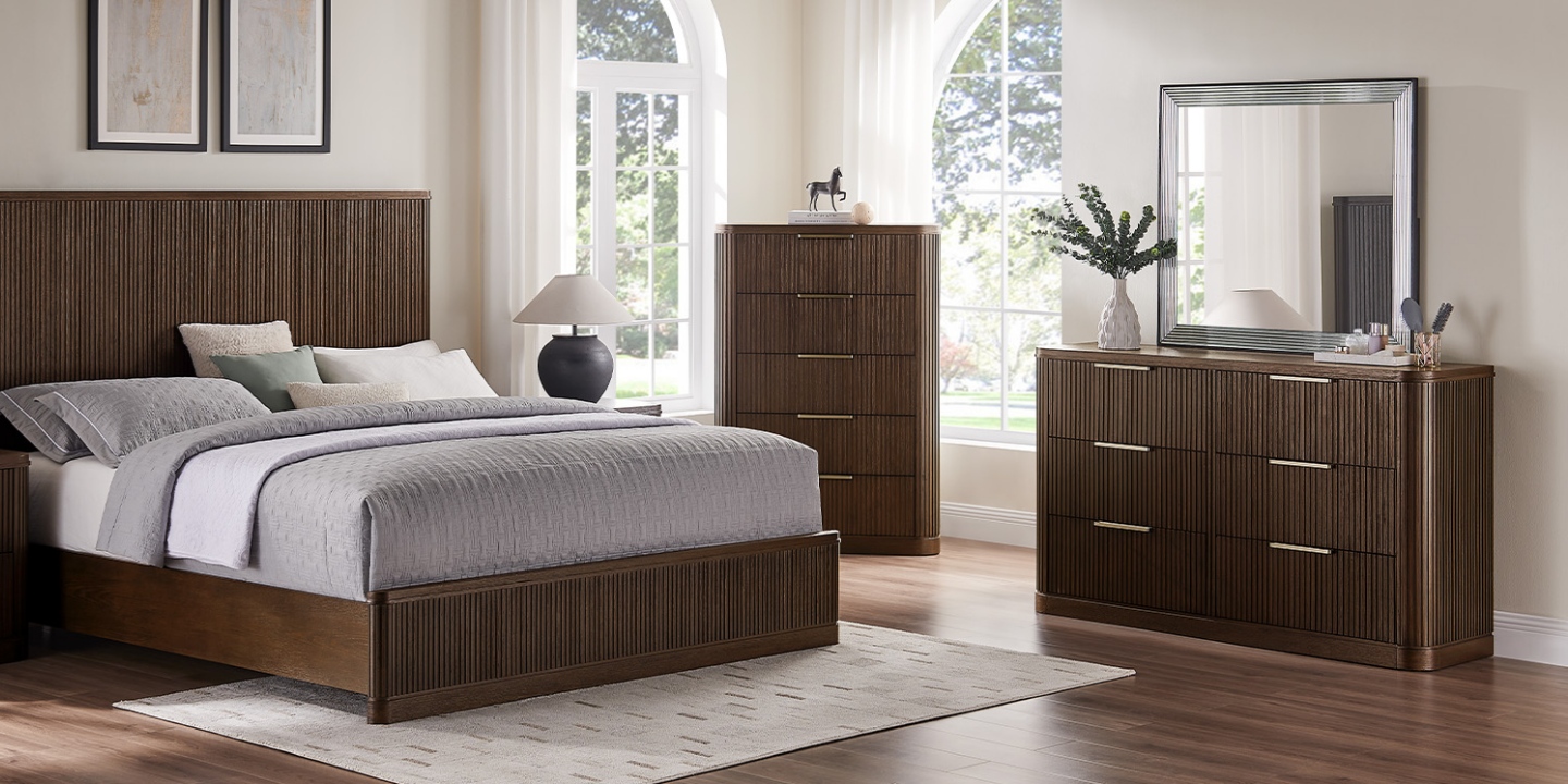 Highlighting various types of furniture, this spacious bedroom includes a fluted bed, tall chest, and 6-drawer dresser. Highlighting various types of furniture, this spacious bedroom includes a fluted bed, tall chest, and 6-drawer dresser.