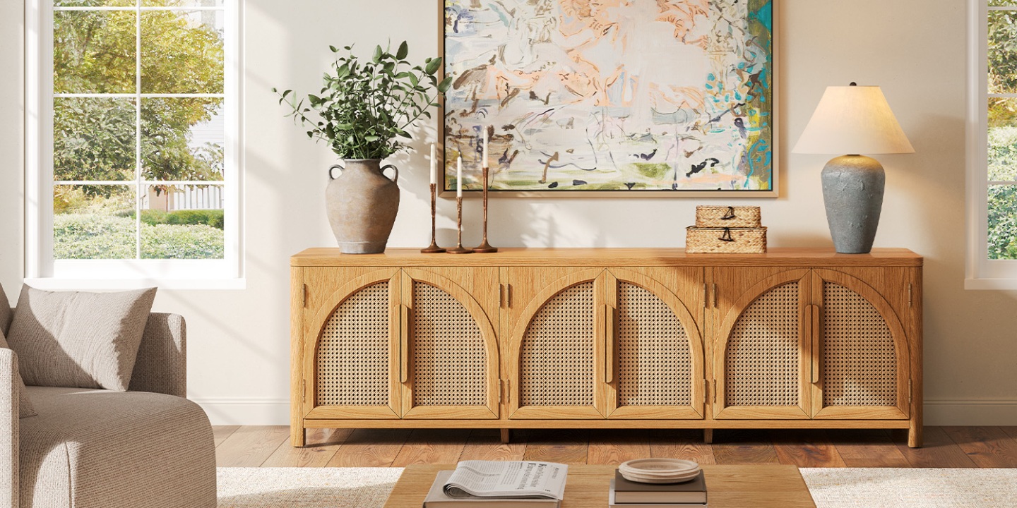 Hernest Alvborg 84-inch rattan TV stand featuring arched woven doors and modern decor in a sunlit living room.