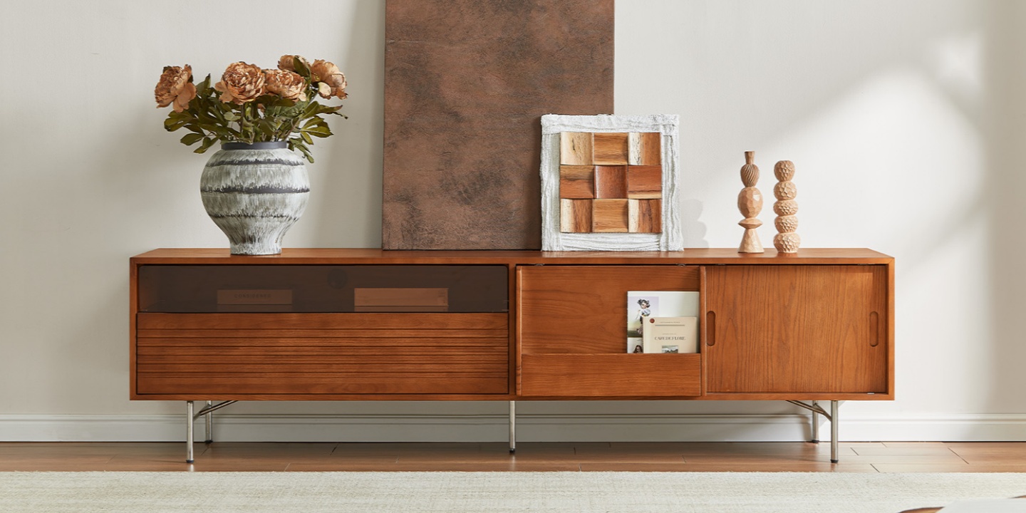 Frode warm ash wood 84-inch media console styled as one of the best tv stands with sliding doors in a bright living room. Frode warm ash wood 84-inch media console styled as one of the best tv stands with sliding doors in a bright living room.