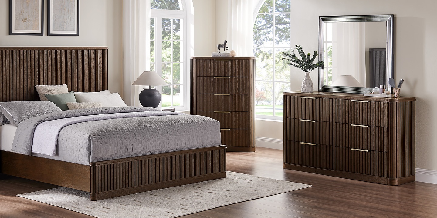 Furniture for Texas homes featuring the Finnley 62 inch fluted 6-drawer dresser with a mirror and warm wood tones. Furniture for Texas homes featuring the Finnley 62 inch fluted 6-drawer dresser with a mirror and warm wood tones.