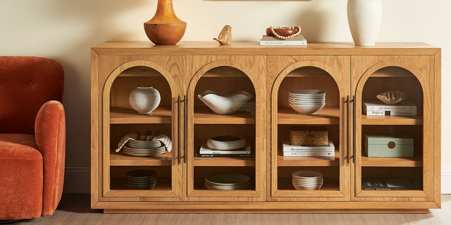 Furniture for New York apartments showcasing the Lira 71" oak sideboard with arched glass doors and spacious shelving. Furniture for New York apartments showcasing the Lira 71" oak sideboard with arched glass doors and spacious shelving.