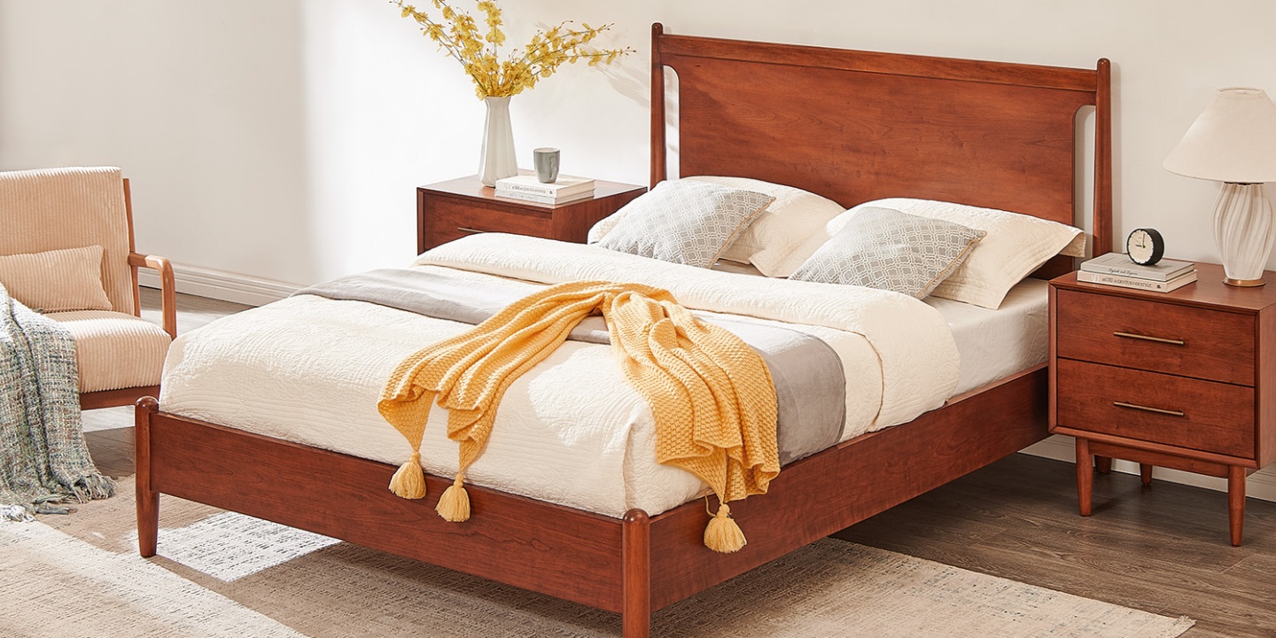 This Kaden mid-century wood bed features an openwork headboard and yellow throw blanket in a cozy bedroom. This Kaden mid-century wood bed features an openwork headboard and yellow throw blanket in a cozy bedroom.