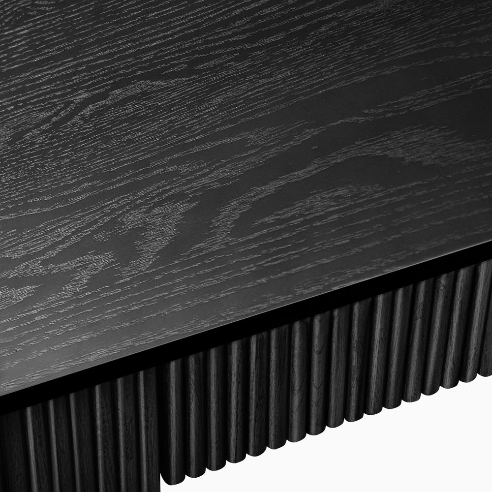 side view of black writing desk