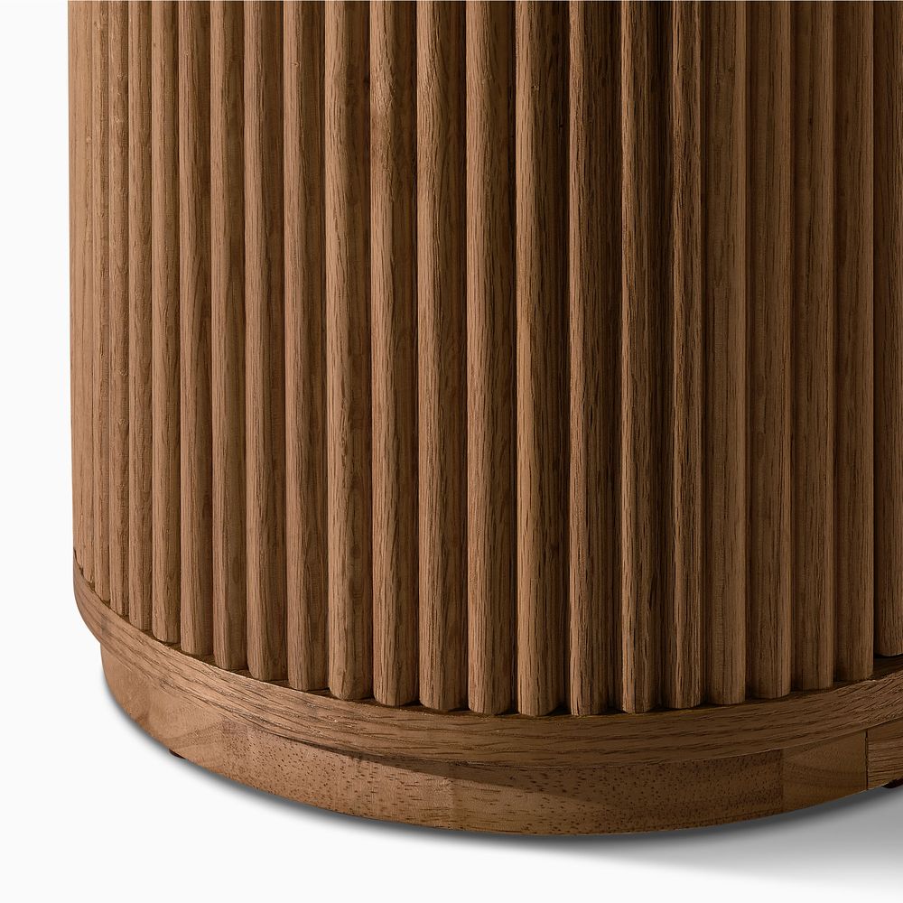 Close-up of the fluted base detail on the Hernest Rolf 63 inch Oak Sideboard, highlighting natural wood texture.