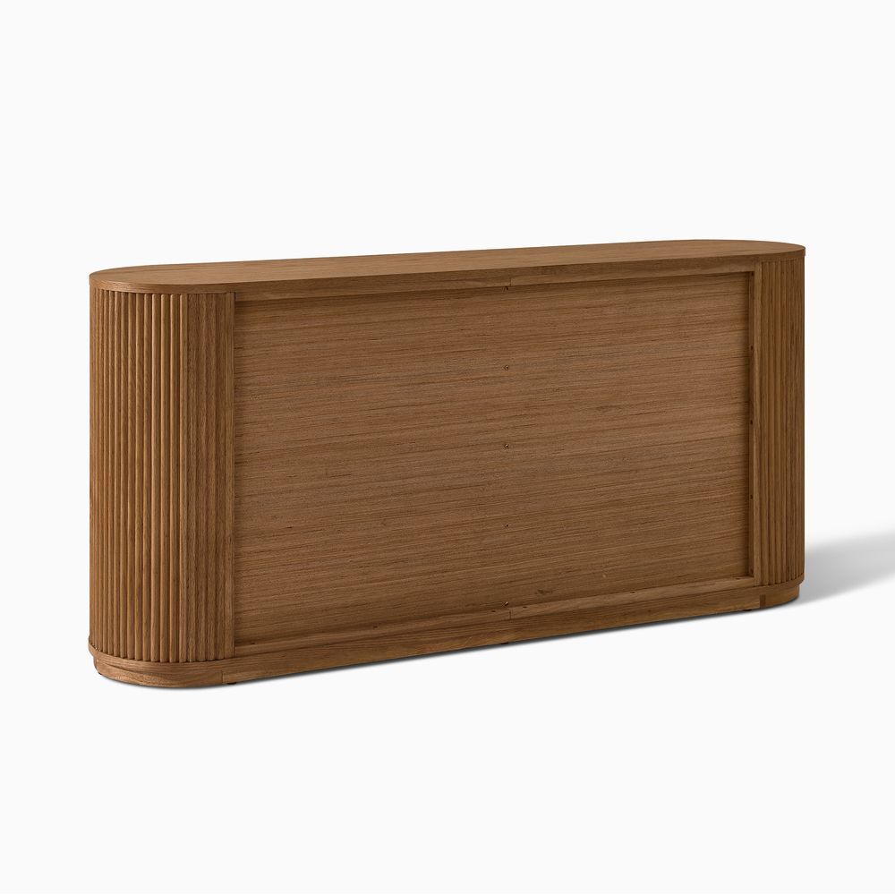 Rear view of the Hernest Rolf 63 inch Oak Sideboard, showcasing the clean wood back panel and rounded fluted side design.