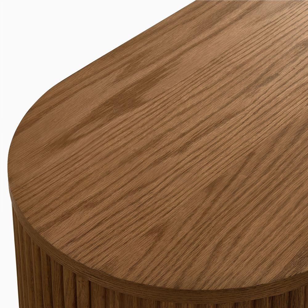 Close-up of the natural oak grain and smooth rounded edge of the Hernest Rolf 63 inch Oak Sideboard, showcasing premium solid wood design.