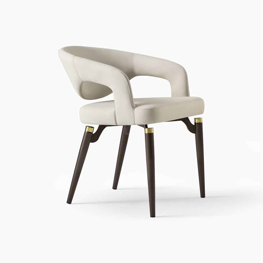 Close-up of the Hernest Liliana Armrest Leather Dining Chair, featuring the golden metal accent on the black leg and PU leather seat.