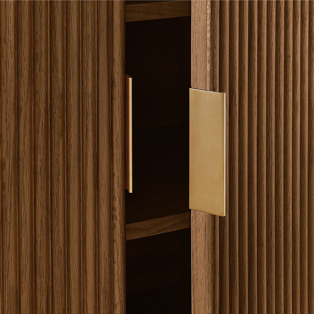 Close-up of fluted oak doors with metal handles on the Hernest Rolf 63 inch Oak Sideboard, showing premium texture.