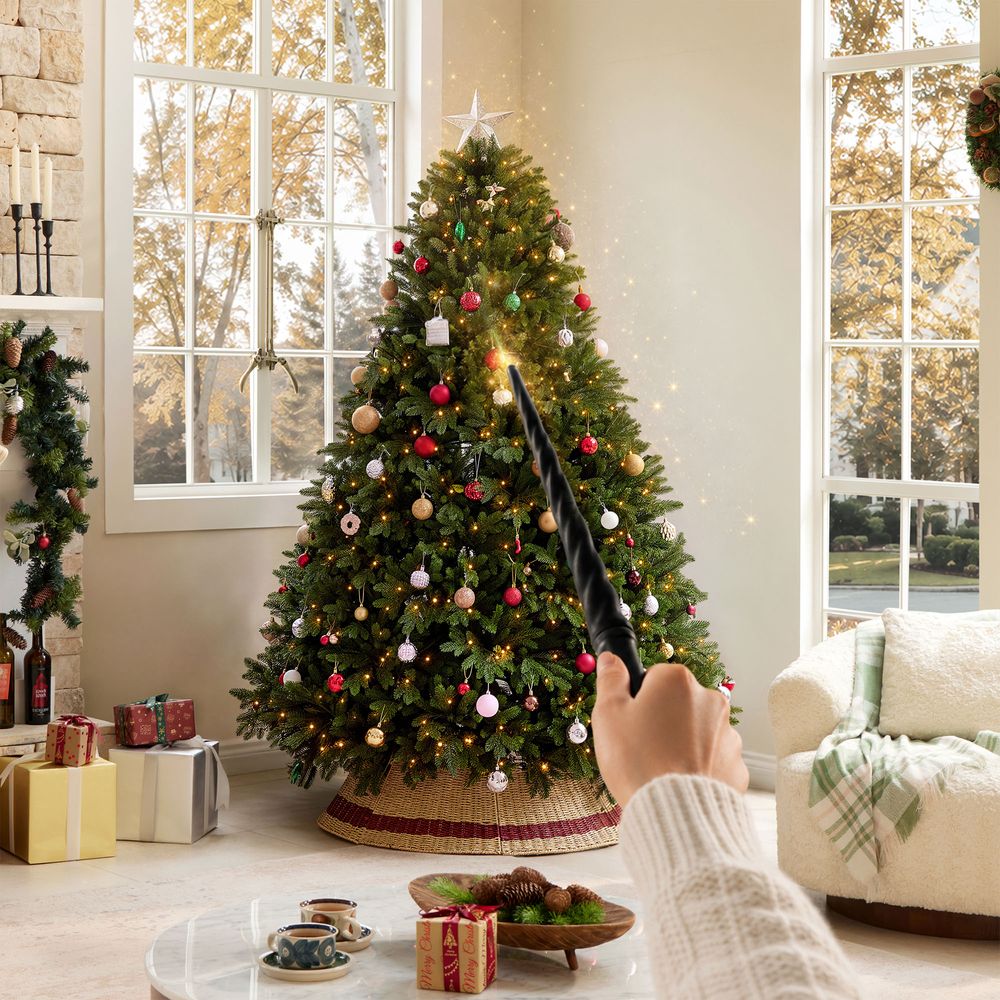 Cozy living room featuring the CastGlow 6.5 ft pre-lit natural green artificial Christmas tree controlled by a magic wand.
