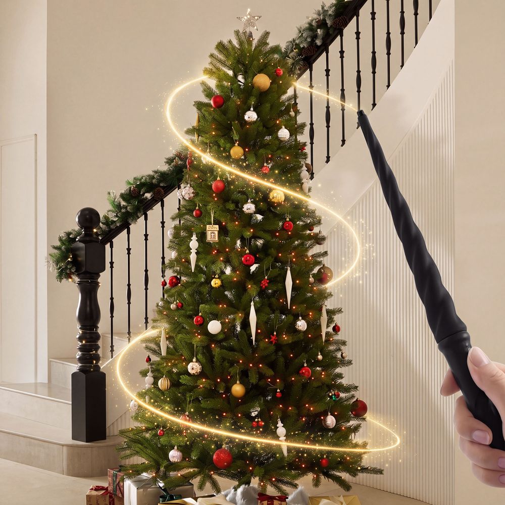 Using the magic wand to control lights on the decorated CastGlow 7.5 ft pre-lit slim green Christmas tree. - image 2 of 14