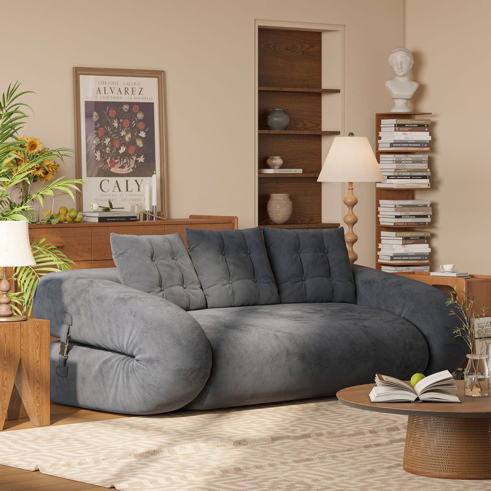 gray velvet sofa bed in study