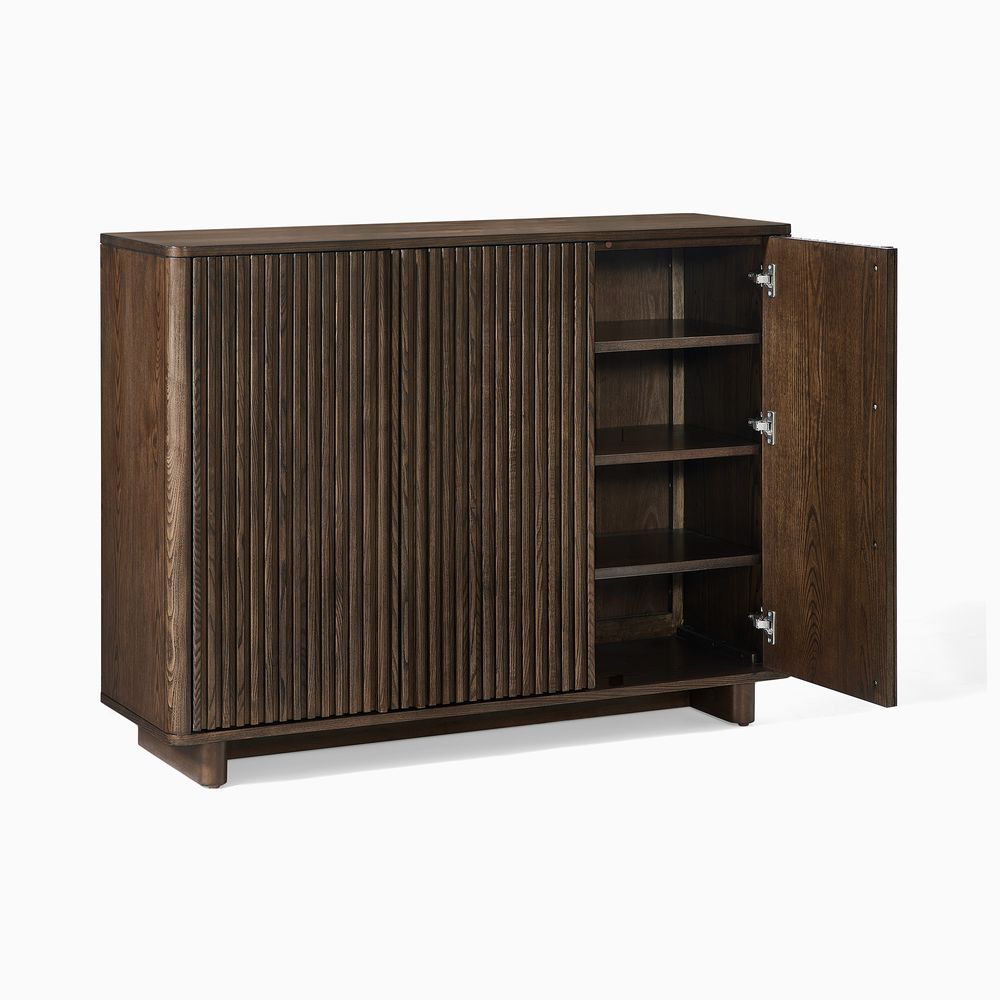 A shoe cabinet with one door open