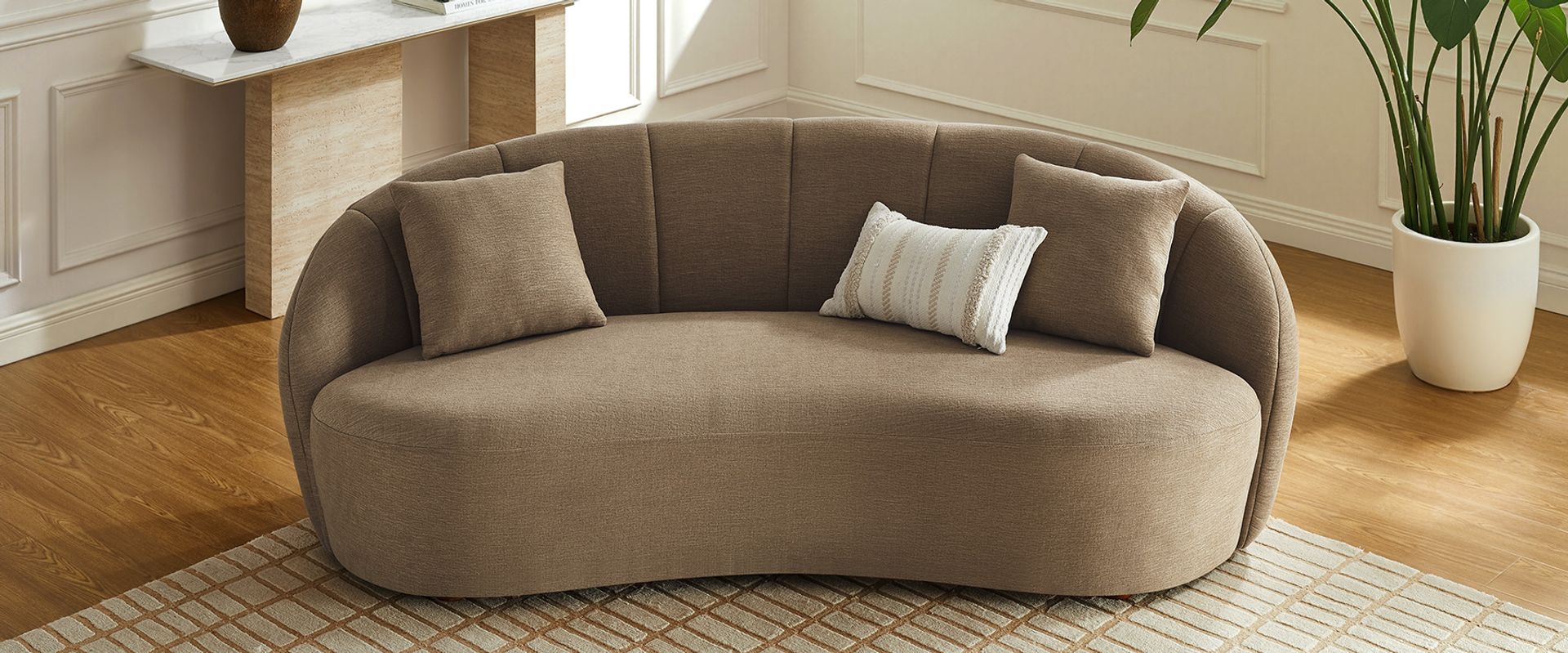 Brown curved loveseat