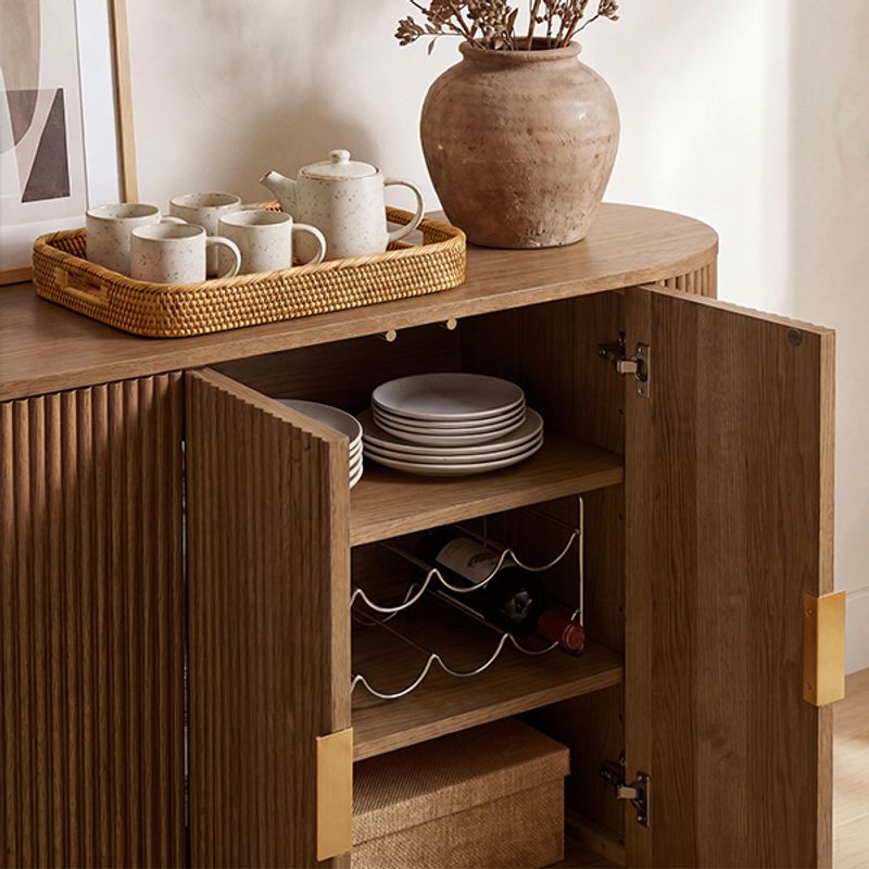 Open view of the Hernest Rolf 63 inch Oak Sideboard interior, showcasing spacious storage for dinnerware and wine.