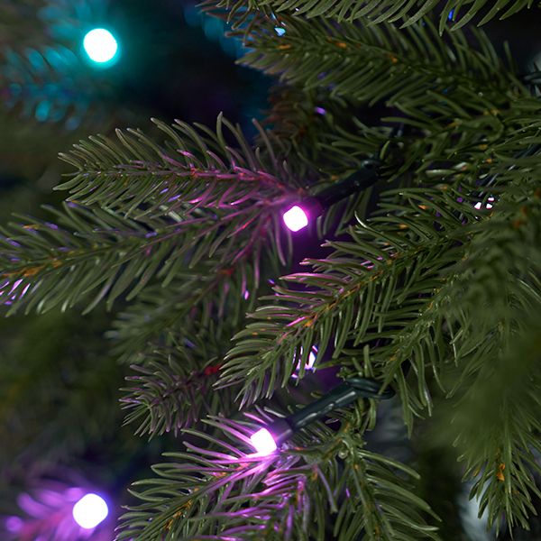 Lifelike natural green 3D PE branches and needles of the pre-lit slim CastGlow Christmas tree.
