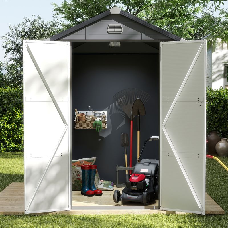 Outdoor lockable storage shed with door opening in garden