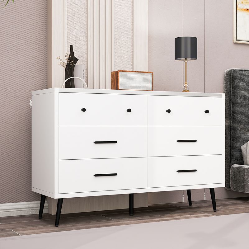 Side view of white bedroom dressers in the bedroom