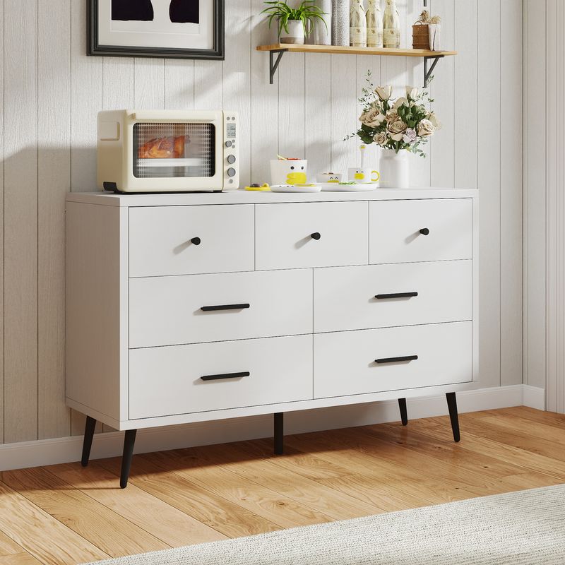 Side view of white 7 drawer dressers