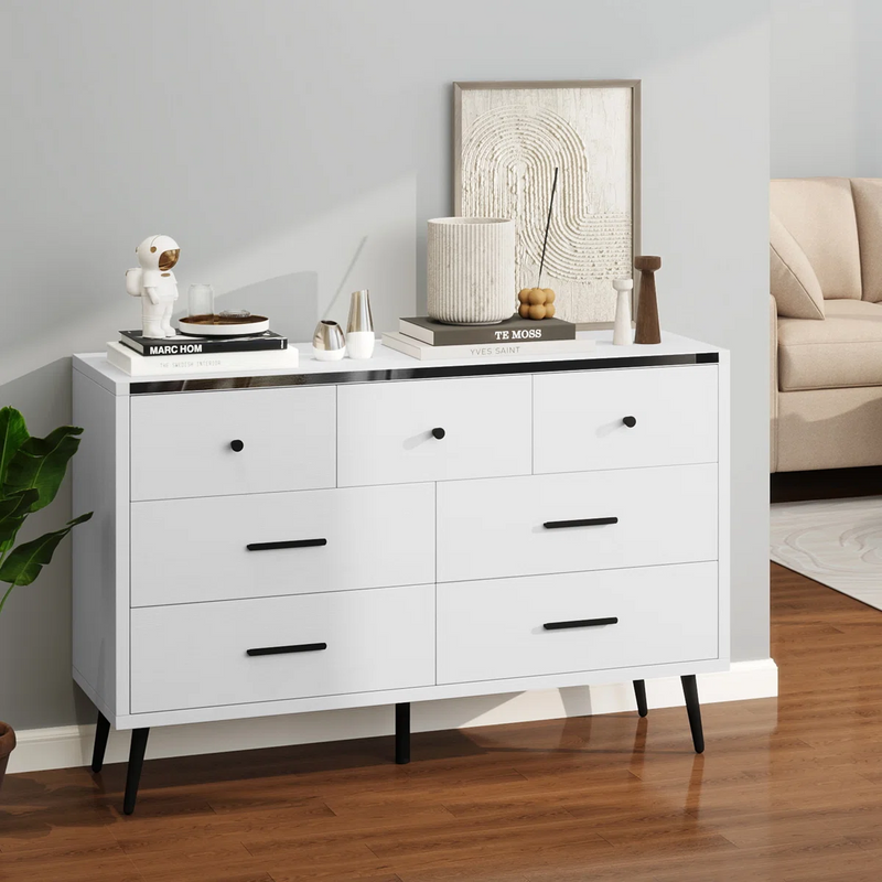 Side view of white 7 drawer dressers