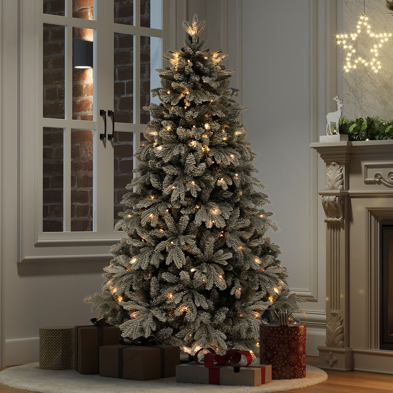 6 FT Pre-Lit Snow Flocked Artificial Christmas Tree in the evening