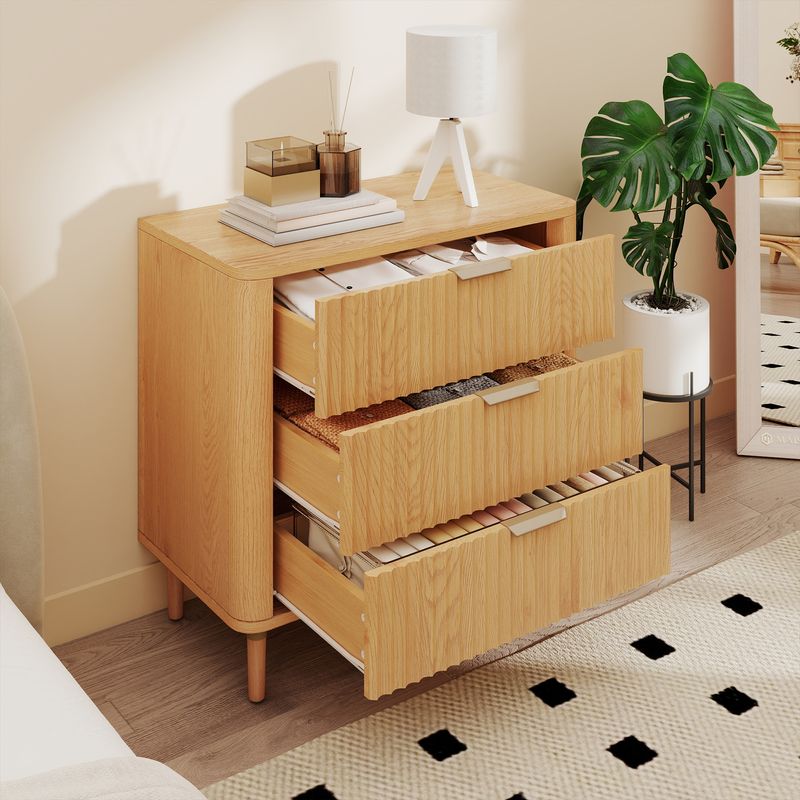 Side view of the small nightstand with open drawer